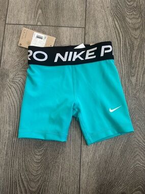 Nike Kids Turquoise Compression Shorts with Black Logo Waistband